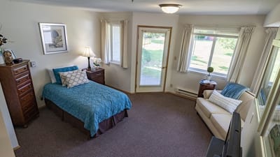 Cozy resident room with a bed and natural light