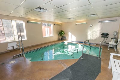 Indoor rehabilitation pool area with seating