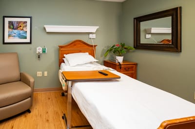 A private resident room with a bed and decor
