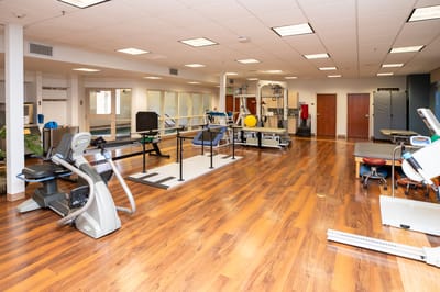 Interior view of a rehabilitation gym with exercise equipment