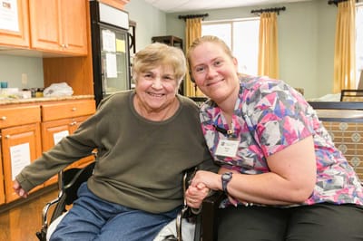 Staff member with a resident in a common area