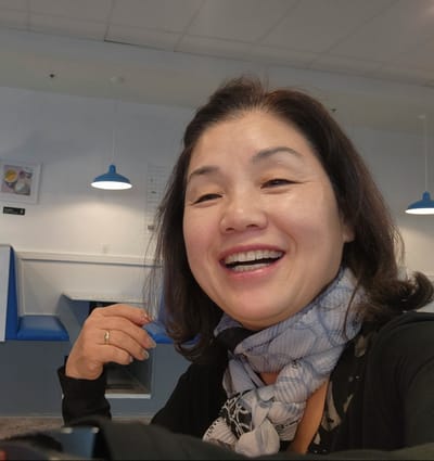 Happy resident enjoying a moment indoors.