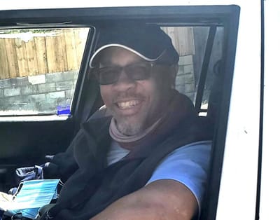 Smiling man in a vehicle