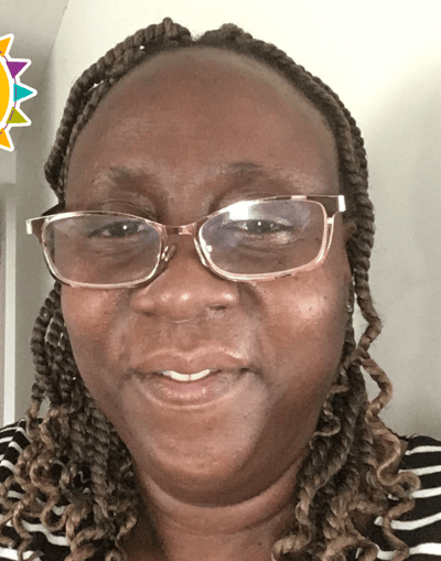 Smiling woman wearing glasses and a striped top