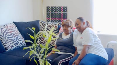 Senior resident and staff member enjoying time together