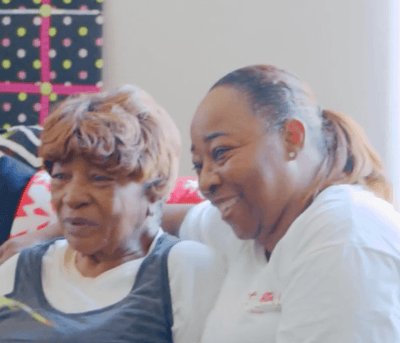 Two women sharing a joyful moment together.