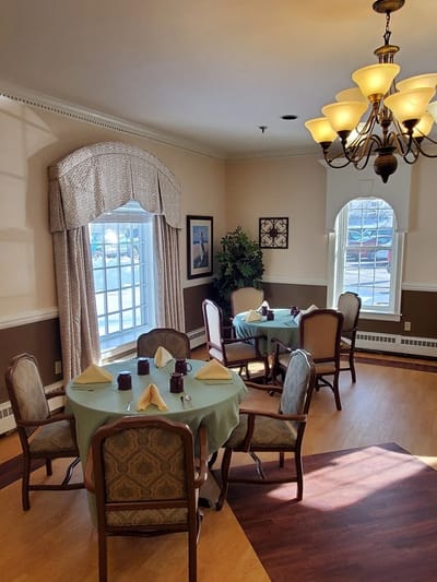 Dining room setup with tables and chairs