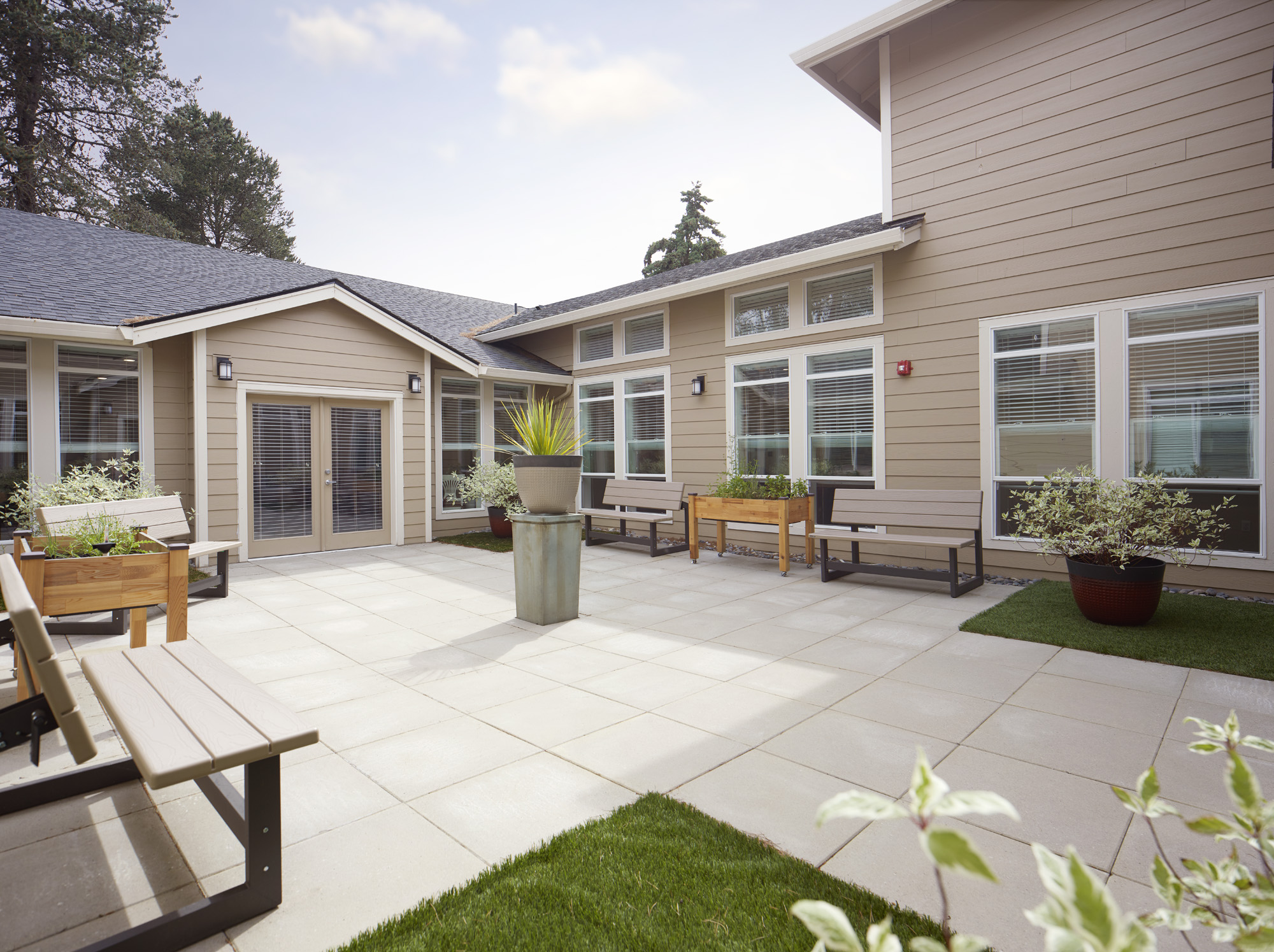 Outdoor courtyard area with seating and plants