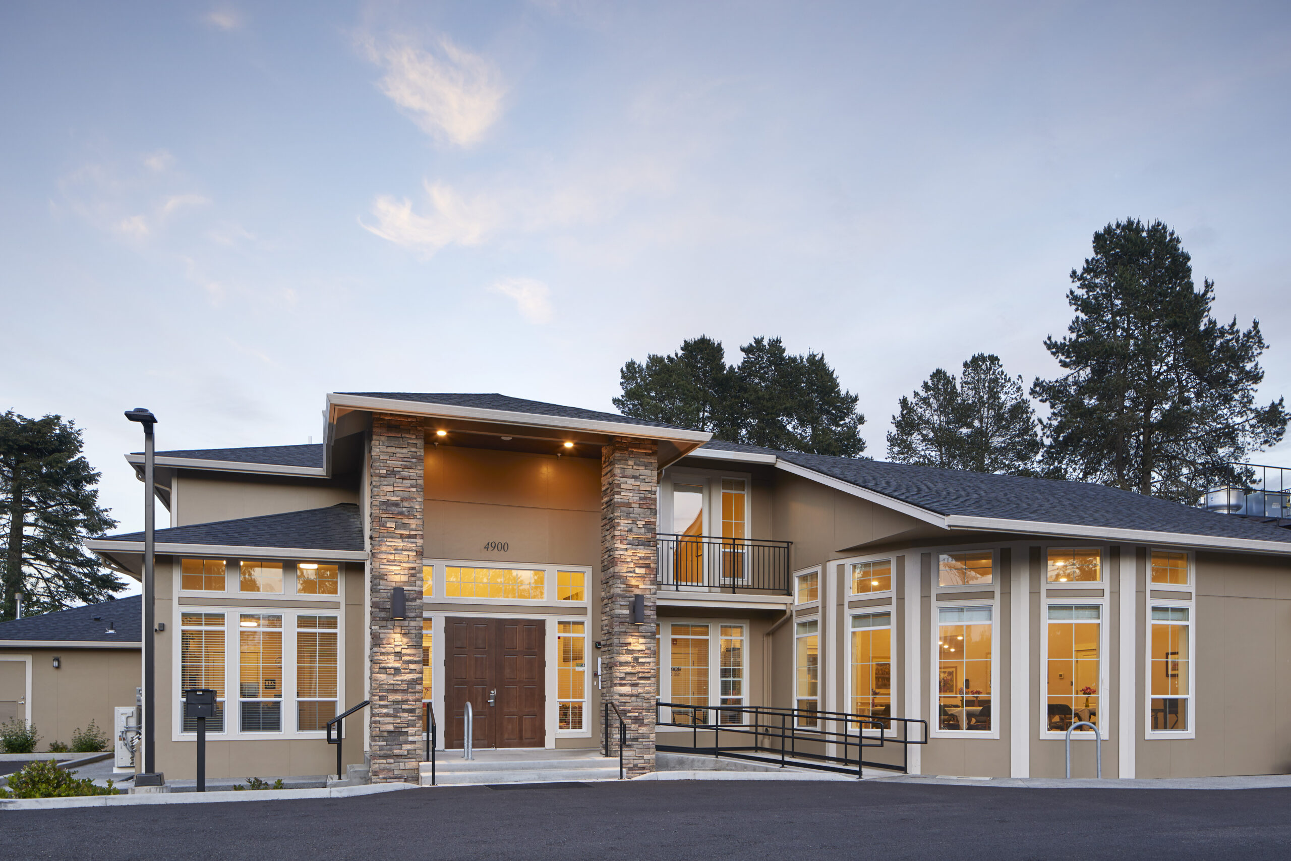 Exterior view of a memory care facility at dusk
