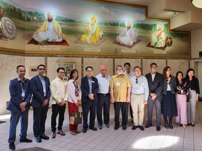 Group of people gathered in a common area with murals
