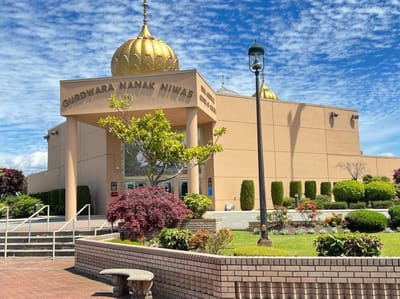 Exterior view of Guru Nanak Niwas with landscaped gardens