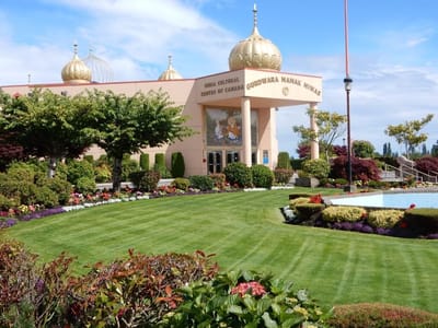 Exterior view of the Guru Nanak Niwas facility with landscaped gardens