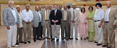 Group photo of residents and staff in a common area