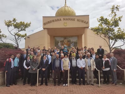 Group photo in front of Guru Nanak Niwas building