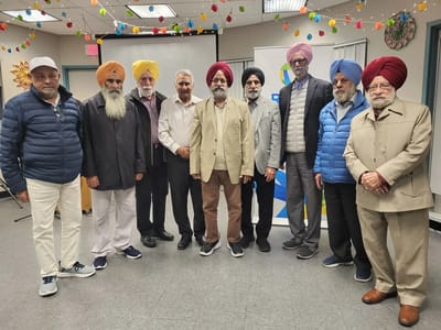 Residents and staff members smiling at a community event