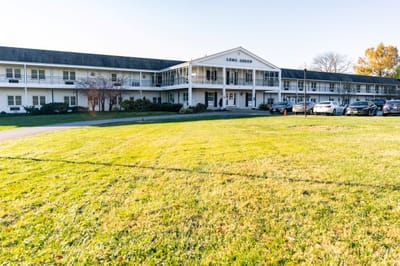 Exterior view of Long Green facility with green lawn