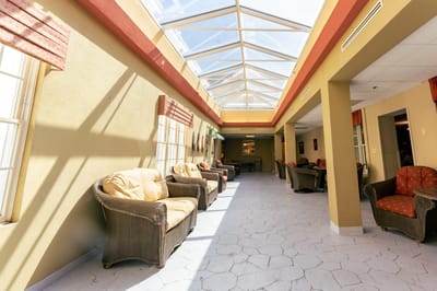 Bright interior common area with seating and skylight