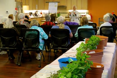 Residents participating in a gardening activity indoors
