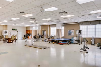 Rehabilitation gym with exercise equipment and therapy tools