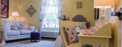Cozy and decorated resident room with light colors