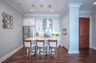 Modern kitchen area with wooden bar stools