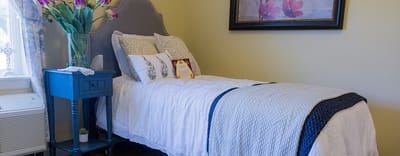 Cozy resident room with single bed and decor