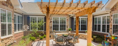 Outdoor patio area with seating and pergola