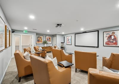 Cozy common area with comfortable seating and movie posters