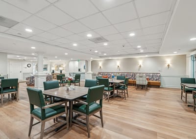 Bright dining area with tables and chairs