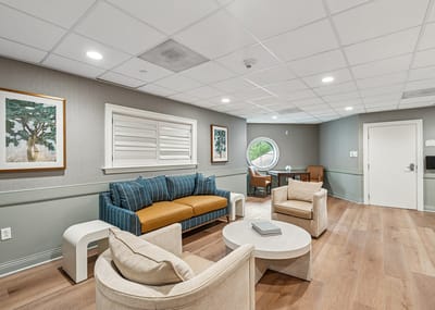 Bright common area with seating and artwork