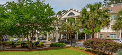 Exterior view of assisted living facility with landscaping