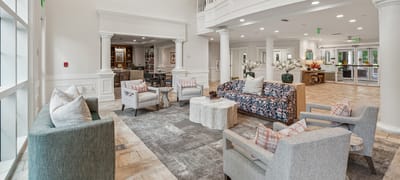 Common area with seating and decor in a senior living facility
