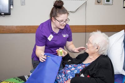 Staff member engaging with an elderly resident