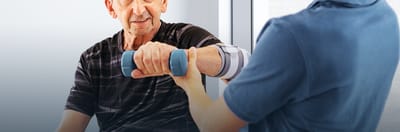 Abingdon Care & Rehabilitation Center, nursing home in Green Brook Township, NJ — Senior resident participating in physical therapy with weights