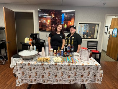 Staff serving refreshments at a community event