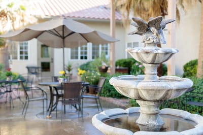 Outdoor courtyard with a fountain and seating area