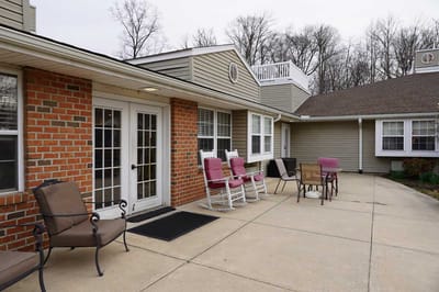 Outdoor seating area with rockers and tables