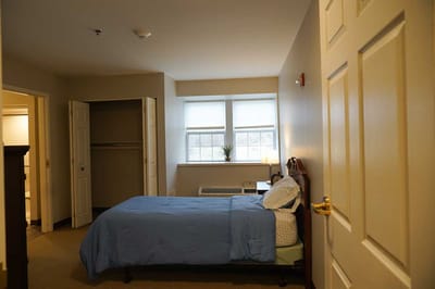 A well-furnished private resident room with natural light