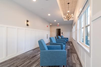 Bright interior hallway with seating chairs