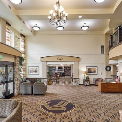 Bright common area with café seating and bookshelves
