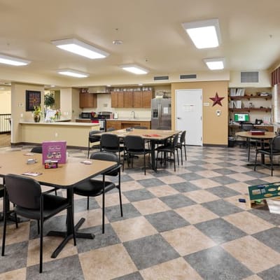 Bright common area with tables and chairs