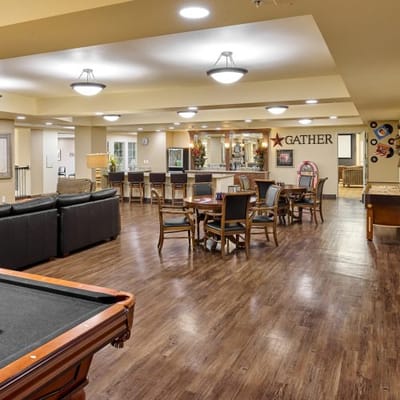 Interior common area with seating and game tables