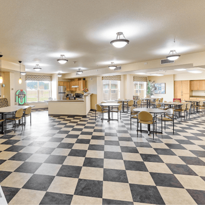 Bright dining room with checkered floor and tables