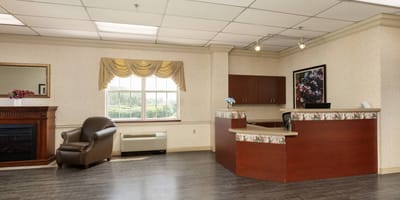 Bright lobby area with a reception desk