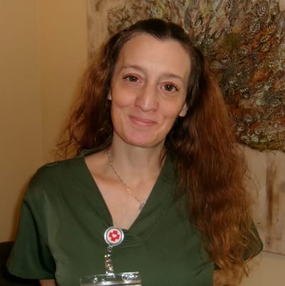 Staff member smiling in a care facility setting