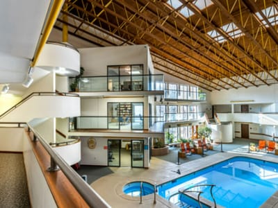 Bright interior view of a recreational area with a pool
