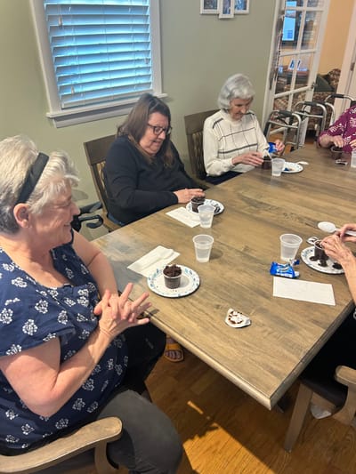 Residents enjoying dessert during a gathering