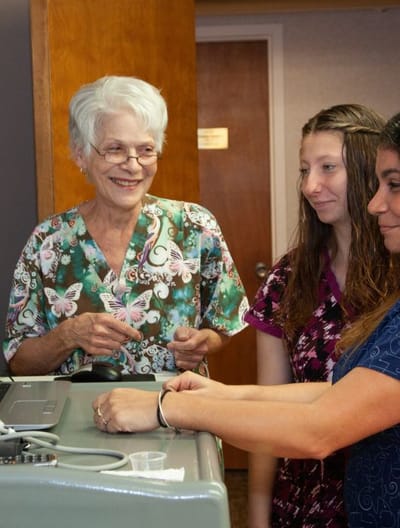 Staff and resident engaging in an activity