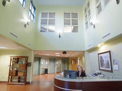 Reception area with staff member at the front desk