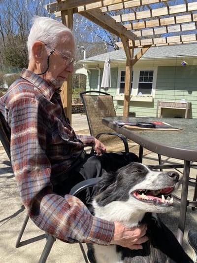 Resident enjoying time outdoors with a dog
